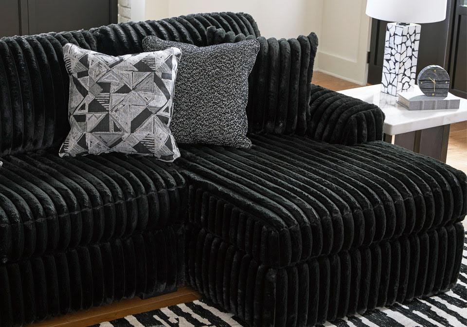 Sofá cama seccional tapizado en chenilla Ashford en color grisáceo