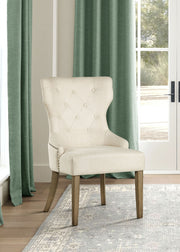 Silla de comedor Baney tapizada en tela beige y negra