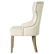 Silla de comedor Baney tapizada en tela beige y negra