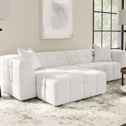 Otomana rectangular tapizada Everly Boucle en color blanco roto