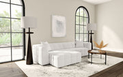 Otomana rectangular tapizada Everly Boucle en color blanco roto