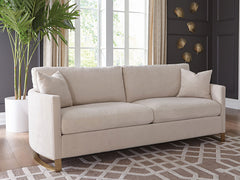 Sofá Corliss tapizado con brazos curvos en beige