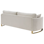 Sofá Corliss tapizado con brazos curvos en beige