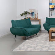 Sillón Acton tapizado con brazos acampanados, color azul verdoso