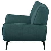Sillón Acton tapizado con brazos acampanados, color azul verdoso