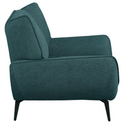 Sillón Acton tapizado con brazos acampanados, color azul verdoso