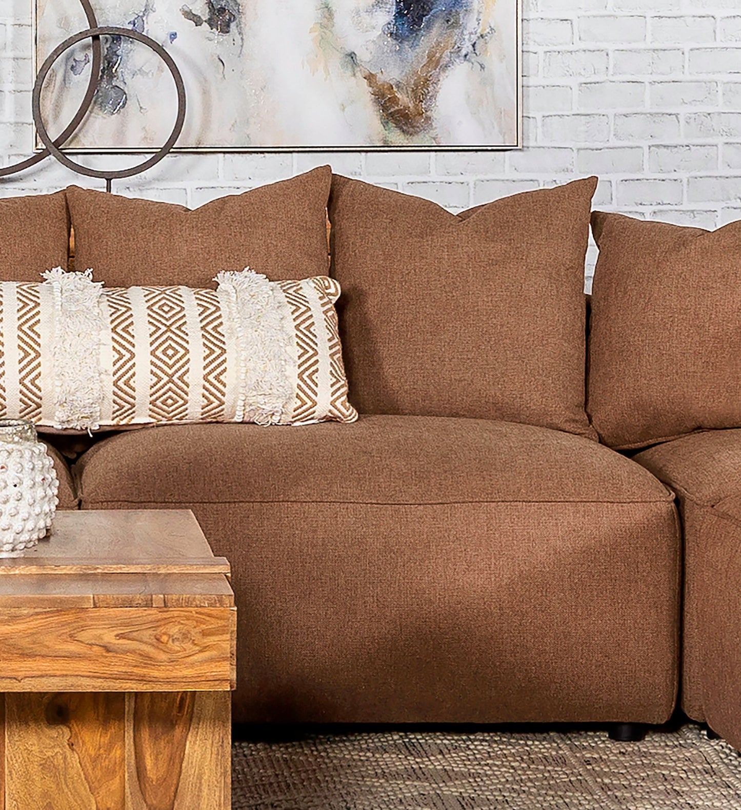 Sillón Jennifer tapizado sin brazos gris