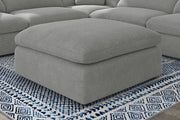 Otomana tapizada Raleigh Boucle gris