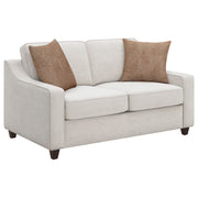 Loveseat tapizado con brazos inclinados Christine en beige