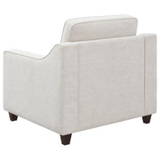 Sillón tapizado con brazos inclinados Christine en beige
