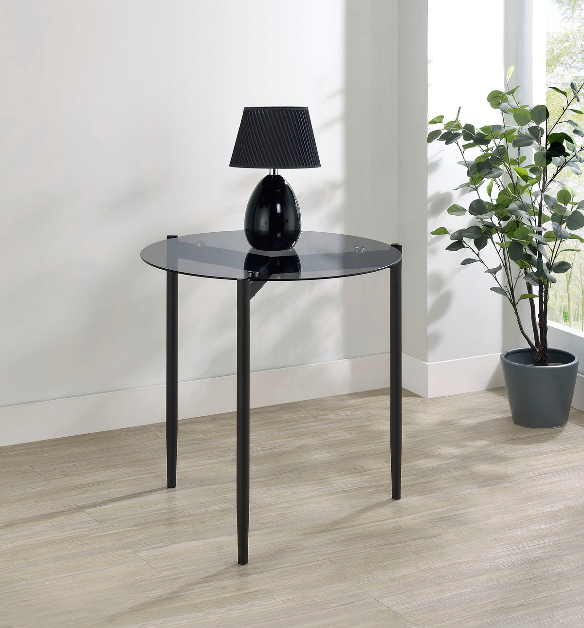 Mesa auxiliar redonda Rosalie con tapa de cristal ahumado en gris