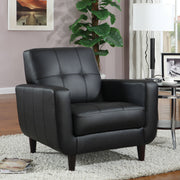 Sillón tapizado Aaron con brazos articulados y capitoné, color negro
