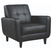 Sillón tapizado Aaron con brazos articulados y capitoné, color negro