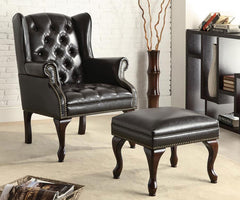 Conjunto de sillón orejero y otomana tapizados Roberts en negro