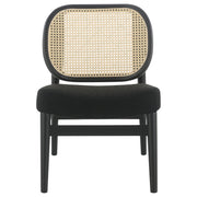 Sillón Rayo con respaldo de caña de ratán y asiento acolchado, color negro