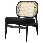 Sillón Rayo con respaldo de caña de ratán y asiento acolchado, color negro
