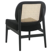 Sillón Rayo con respaldo de caña de ratán y asiento acolchado, color negro
