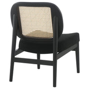 Sillón Rayo con respaldo de caña de ratán y asiento acolchado, color negro