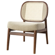 Sillón Rayo con respaldo de caña de ratán y asiento acolchado, color negro