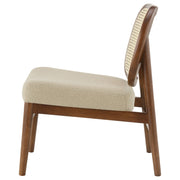Sillón Rayo con respaldo de caña de ratán y asiento acolchado, color negro