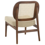 Sillón Rayo con respaldo de caña de ratán y asiento acolchado, color negro