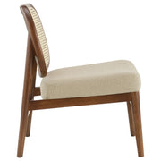Sillón Rayo con respaldo de caña de ratán y asiento acolchado, color negro