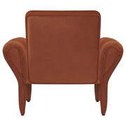 Sillón tapizado con brazos enrollables Liana, color naranja óxido