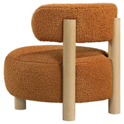 Silla decorativa Zonie Boucle con respaldo de barril tapizado en naranja