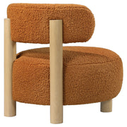 Silla decorativa Zonie Boucle con respaldo de barril tapizado en naranja