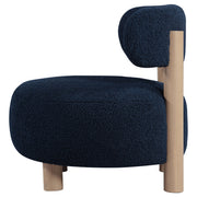 Silla decorativa Zonie Boucle con respaldo de barril tapizado en naranja