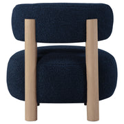 Silla decorativa Zonie Boucle con respaldo de barril tapizado en naranja