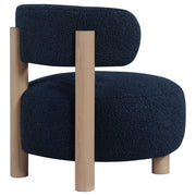 Silla decorativa Zonie Boucle con respaldo de barril tapizado en naranja