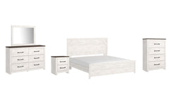Gerridan King Panel Bed with Mirrored Dresser, Chest and Nightstand