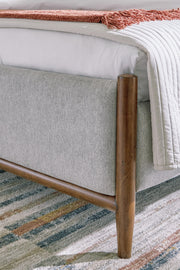 Lyncott California King Upholstered Bed with Mirrored Dresser