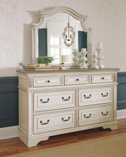 Realyn King Upholstered Panel Bed with Mirrored Dresser and Chest