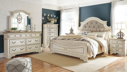 Realyn King Upholstered Panel Bed with Mirrored Dresser