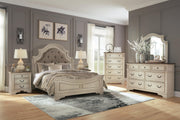 Realyn Queen Upholstered Panel Bed with Mirrored Dresser