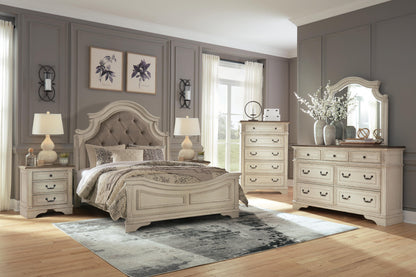 Realyn Queen Upholstered Panel Bed with Mirrored Dresser