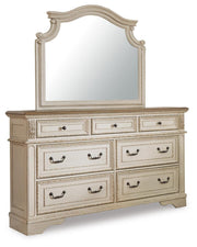 Realyn King Upholstered Panel Bed with Mirrored Dresser