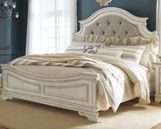 Realyn California King Upholstered Panel Bed with Mirrored Dresser and Chest