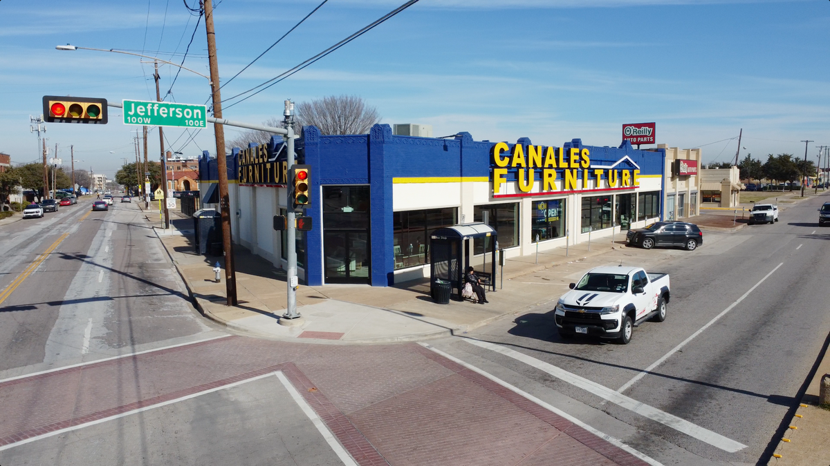 The storefront of Canales Furniture in Oak Cliff, TX.