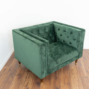 Sillón Evelyn de terciopelo verde oscuro