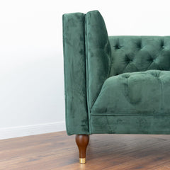 Sillón Evelyn de terciopelo verde oscuro
