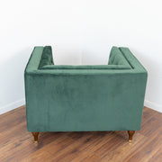 Sillón Evelyn de terciopelo verde oscuro