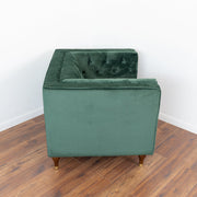 Sillón Evelyn de terciopelo verde oscuro