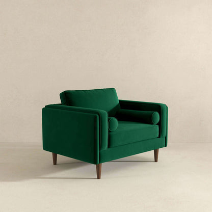 Sillón de terciopelo verde oscuro ámbar