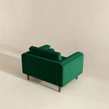 Sillón de terciopelo verde oscuro ámbar
