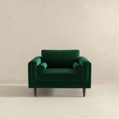 Sillón de terciopelo verde oscuro ámbar
