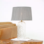 Lámpara de mesa Luxora dorada - Transparente y gris
