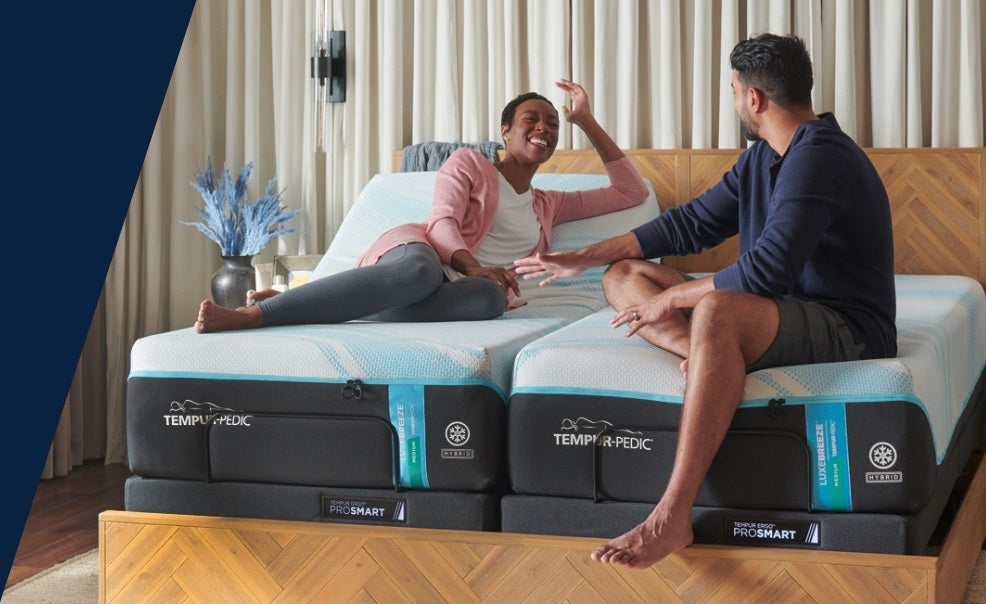 Couple relaxing on a Tempur-Pedic mattress